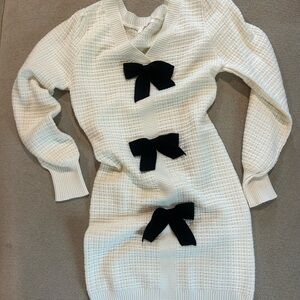 Chic White Knit Midi Dress with Black Bow Details